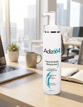 Load image into Gallery viewer, Adize64 Hand & Body Moisturizer 250 ml bottle on office desk.