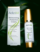 Load image into Gallery viewer, Adize64 Moisturizing Protective Cream 50 ml bottle and carton against green leaves.