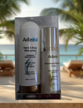 Load image into Gallery viewer, Adize64 Travel Kit clear box showing Hand & Body Moisturizer and Moisturizing Protective Cream on a seaside terrace