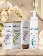 Load image into Gallery viewer, Four Adize64 skincare products on a bathroom counter beside white orchids.
